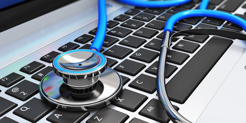 Healthcare and medicine or computer antivirus protection and repair maintenance service concept: macro view of blue stethoscope on business office laptop notebook keyboard with selective focus effect